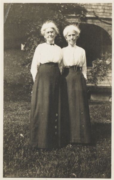 Ellen Lloyd Jones and her sister Jane Lloyd Jones standing in front of the Hillside School which they founded and managed. 